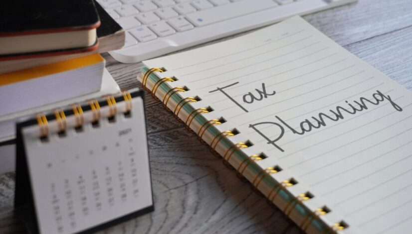 closeup-image-of-notebook-with-text-tax-planning-a-2023-11-27-05-13-13-utc